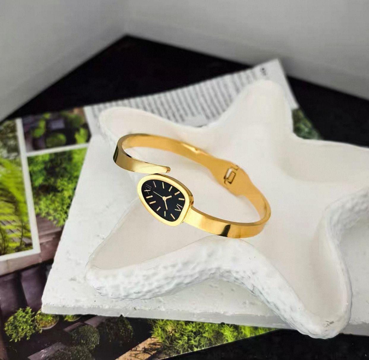 Serpentine style bangle watch