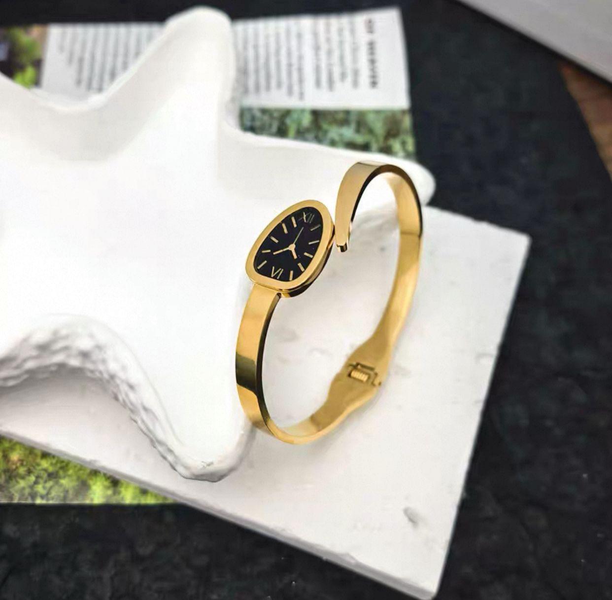 Serpentine style bangle watch